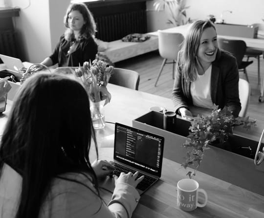 3 Women are working at the office